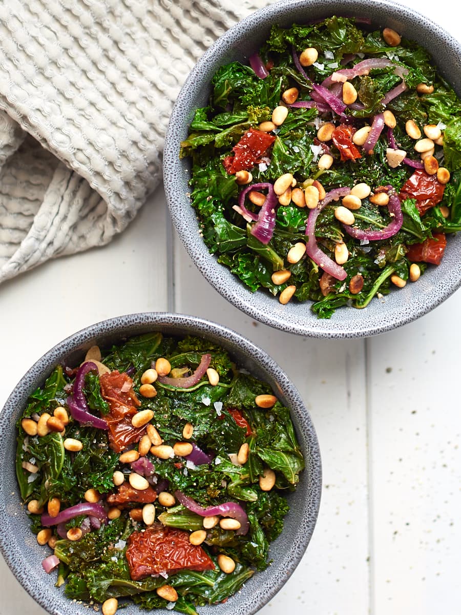Sauteed Kale with Garlic and Toasted Pine Nuts in bowls