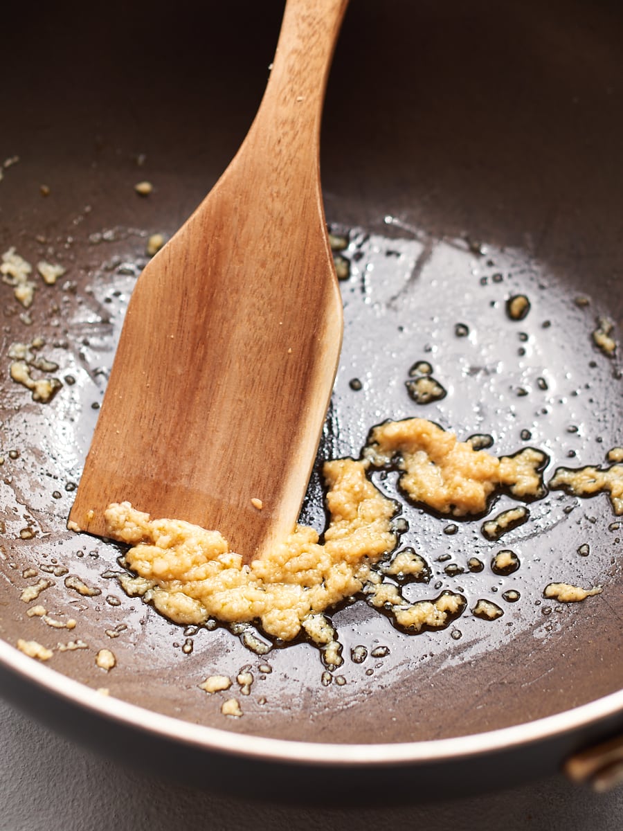 Frying garlic in pan