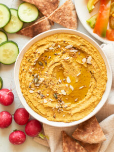 homemade carrot broad bean hummus in bowl