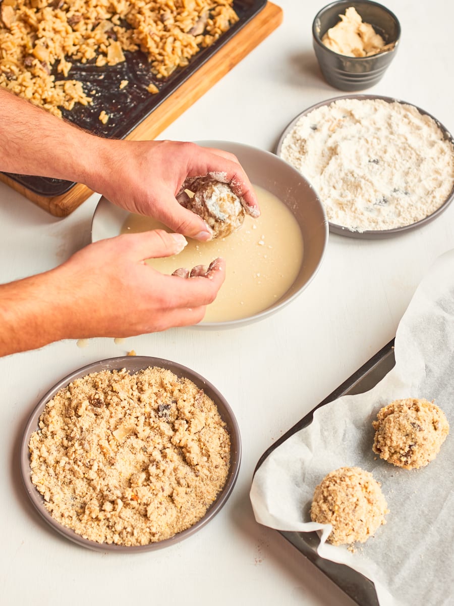 Dip arancini ball into aquafaba