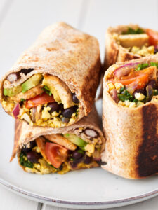 Two breakfast burritos on a plate