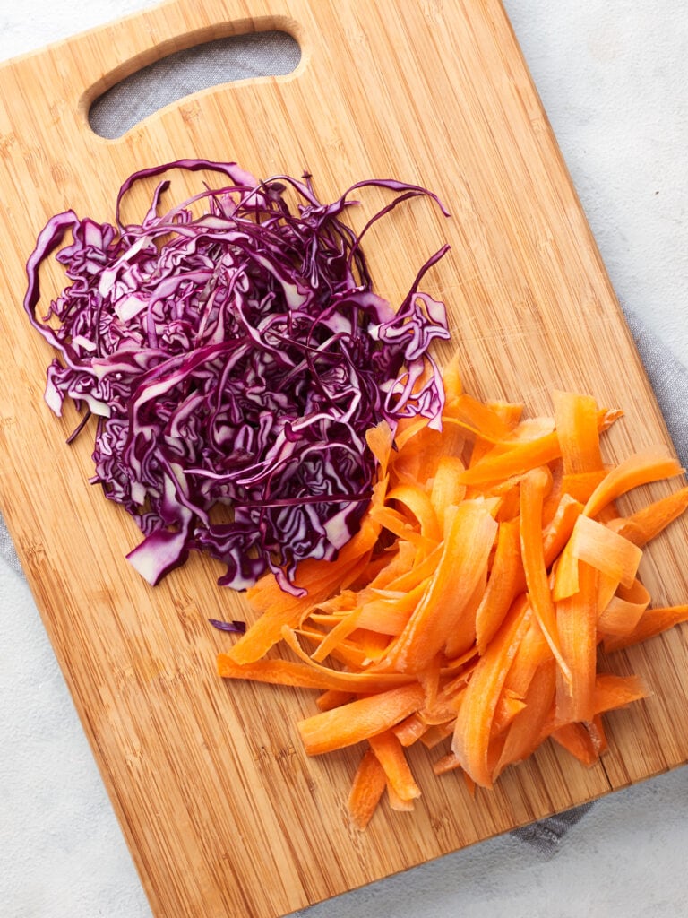 Chopped carrot and cabbage on the chopping board