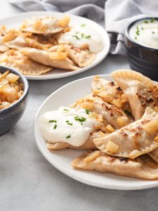 Two plates of pierogi ruskie