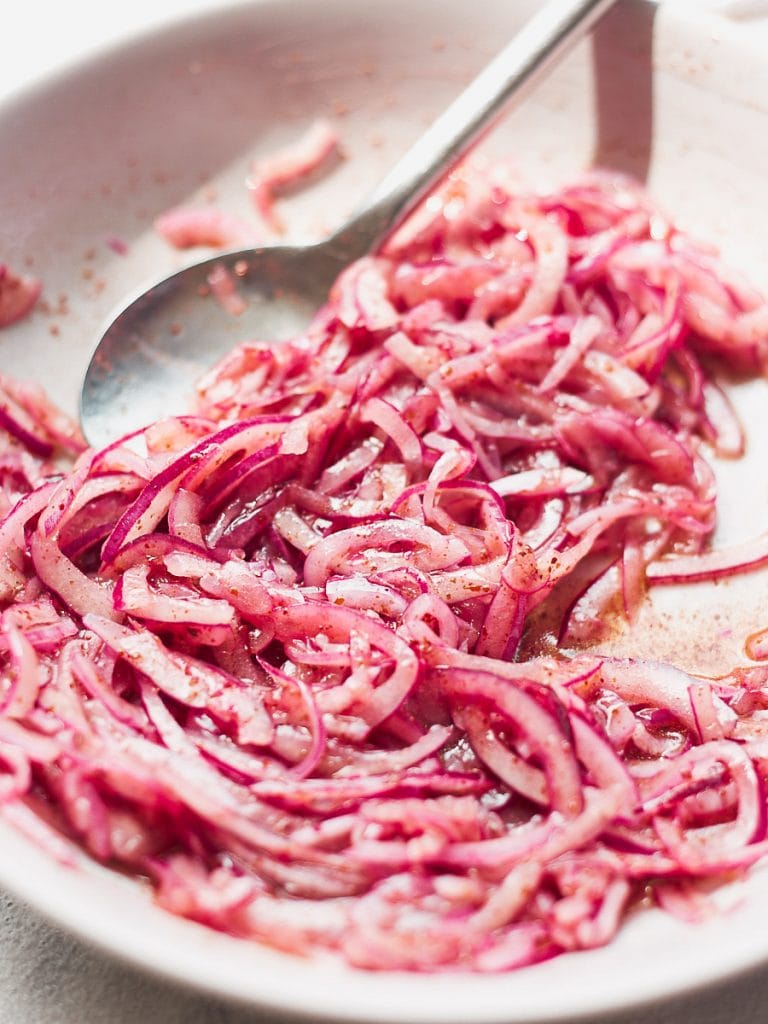 Close up photograph of a bowl of sumac onions