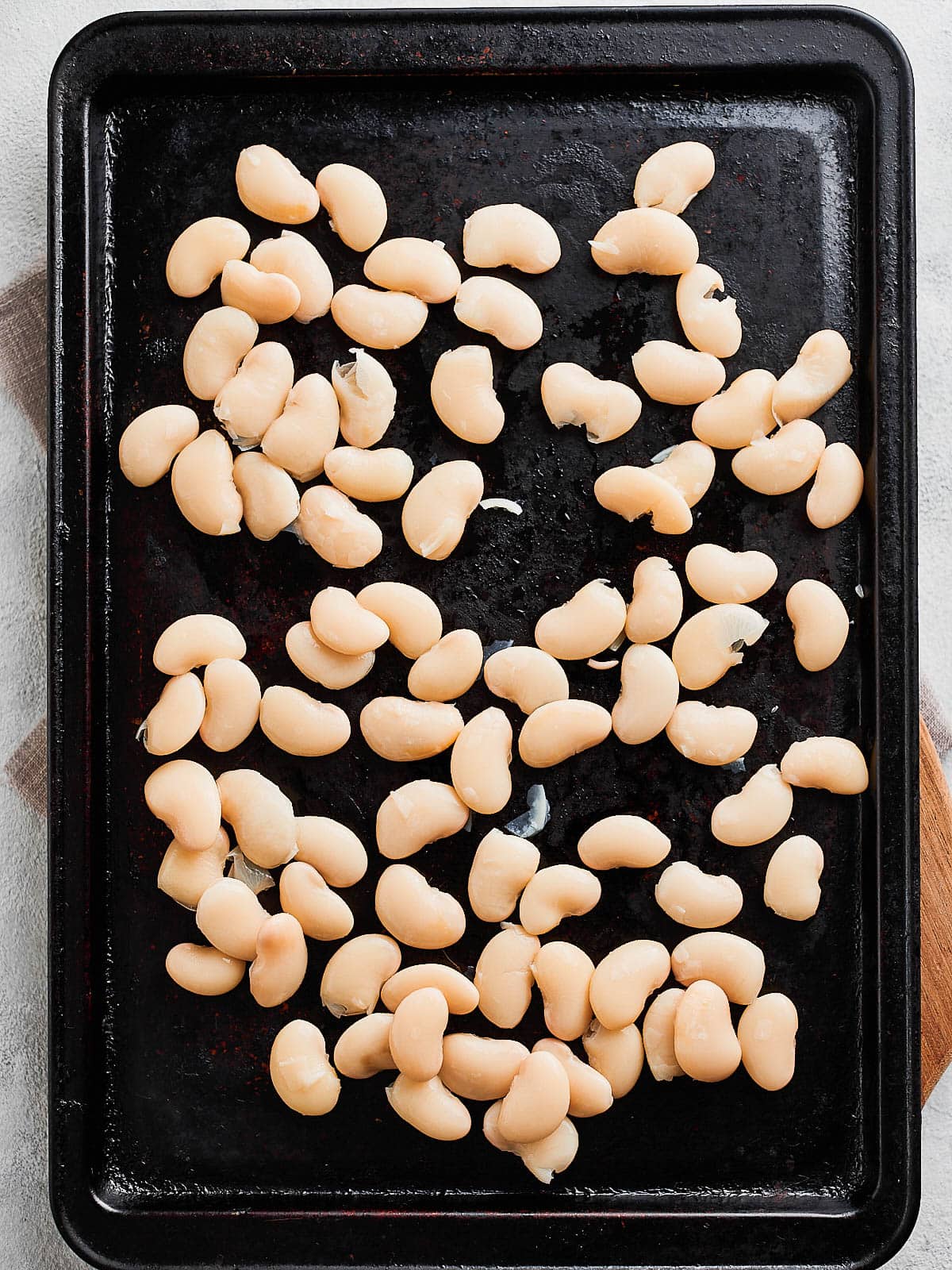 Butter beans on a baking tray