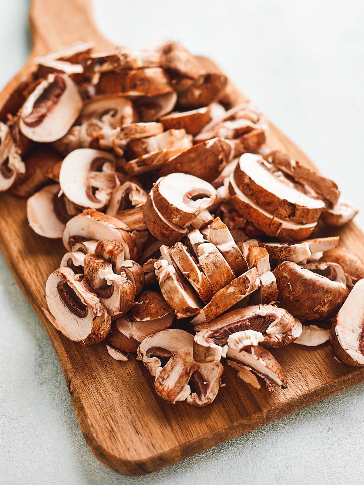 Close up of some chopped mushrooms on a board