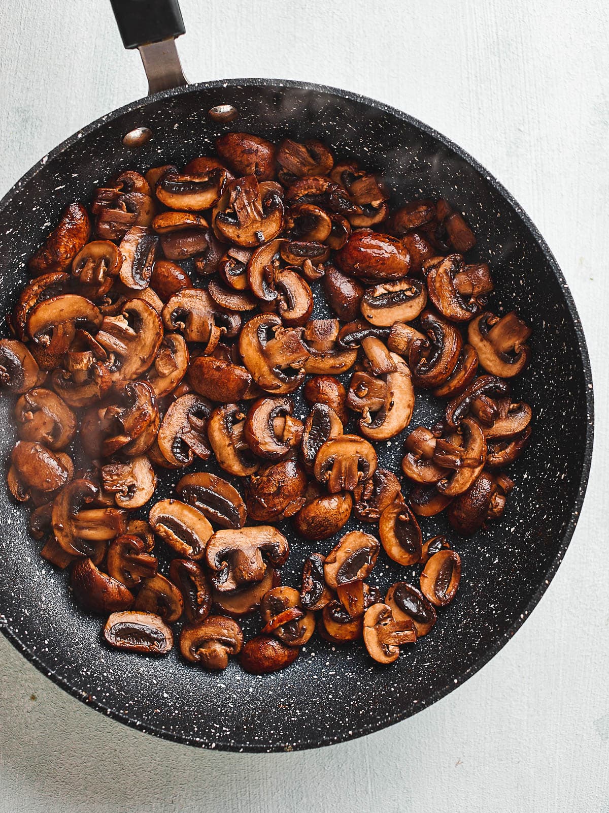 Mushrooms in frying pan once cooked down and dry