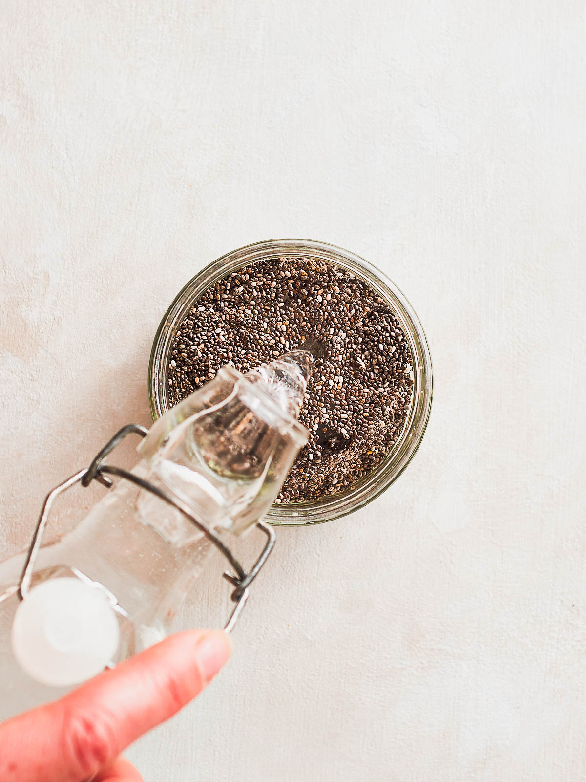 Adding water to ramekin of chia seeds