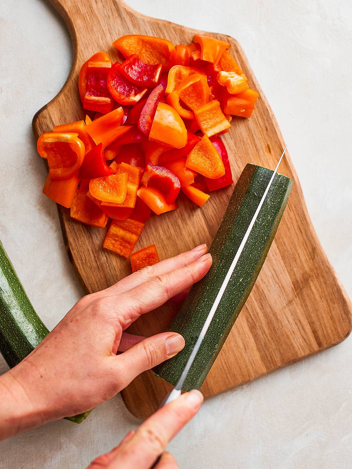 Chop the zucchini in half lengthways, then half again to create quarters