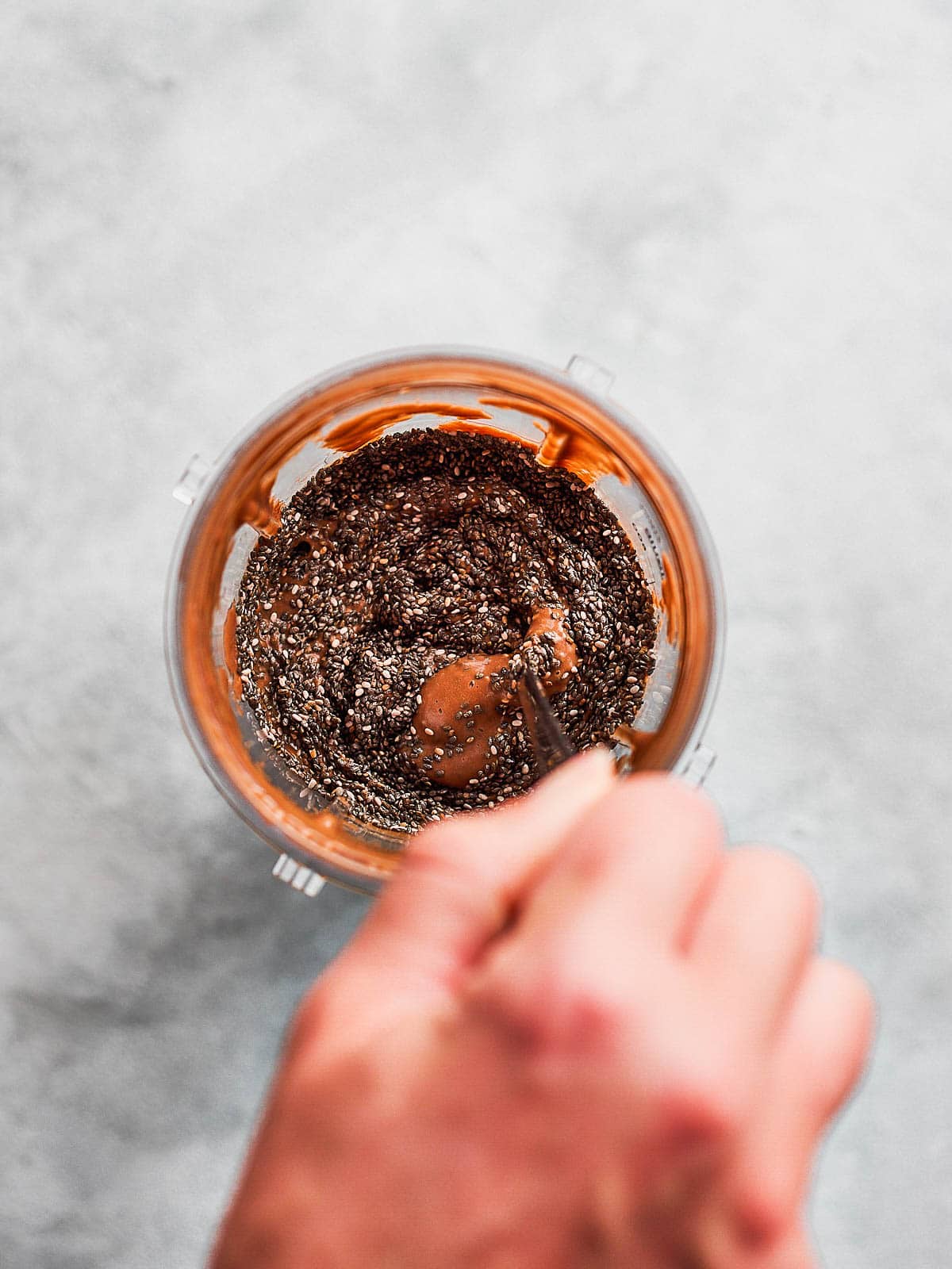 Stirring chia seeds into pudding